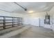 Clean two car garage featuring built-in shelving at 10609 E Durant Dr, Mesa, AZ 85212