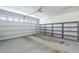 Spacious two car garage with a garage door and shelving at 10609 E Durant Dr, Mesa, AZ 85212