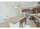 Modern kitchen featuring a center island with sink, stainless steel appliances, and ample counter space at 10609 E Durant Dr, Mesa, AZ 85212