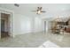 Open-concept living and dining area with tile flooring, recessed lighting, and abundant natural light at 10609 E Durant Dr, Mesa, AZ 85212
