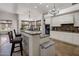 Bright kitchen with white cabinets, granite countertops, and stainless steel appliances at 10892 E Gold Dust Ave, Scottsdale, AZ 85259