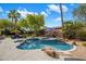 Resort-style backyard with a sparkling pool, spa, and beautifully landscaped surroundings at 10892 E Gold Dust Ave, Scottsdale, AZ 85259