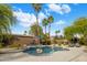 Beautiful backyard pool and spa area with lush landscaping and inviting lounge spaces at 10892 E Gold Dust Ave, Scottsdale, AZ 85259