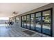 Spacious back patio with a covered seating area, ceiling fan, and views of the backyard oasis at 11215 N 37Th Ave, Phoenix, AZ 85029
