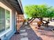 Charming front yard featuring a mature tree, bench seating, and meticulously maintained landscaping for enhanced curb appeal at 11215 N 37Th Ave, Phoenix, AZ 85029