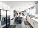 Spacious and open kitchen featuring white cabinetry, stainless steel appliances, and a large center island at 11215 N 37Th Ave, Phoenix, AZ 85029