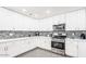 Bright kitchen featuring stainless steel appliances, granite counters, and a tile backsplash at 11215 N 37Th Ave, Phoenix, AZ 85029