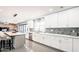 Modern kitchen featuring an island, stainless steel appliances, and white cabinetry at 11215 N 37Th Ave, Phoenix, AZ 85029