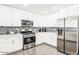 Bright kitchen featuring stainless steel appliances, granite counters, and a tile backsplash at 11215 N 37Th Ave, Phoenix, AZ 85029