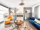 Sophisticated living room with a modern fireplace, colorful furniture, and stylish decor, creating a welcoming and elegant space at 11215 N 37Th Ave, Phoenix, AZ 85029
