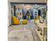 Spacious living room with stylish decor, including a fireplace, plush seating, and large windows for ample natural light at 11215 N 37Th Ave, Phoenix, AZ 85029