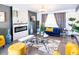 Charming living room features a modern fireplace, stylish decor, and bright, inviting light at 11215 N 37Th Ave, Phoenix, AZ 85029