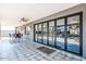 Covered outdoor patio with tiled flooring, ceiling fan, and sliding glass doors that offer seamless indoor-outdoor living at 11215 N 37Th Ave, Phoenix, AZ 85029