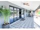Covered patio featuring tiled floors, ceiling fans, and sliding glass doors for seamless indoor-outdoor living and entertaining at 11215 N 37Th Ave, Phoenix, AZ 85029