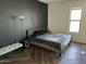 Modern bedroom features sleek dark accent wall, plush bedding, and contemporary furnishings at 1130 N 2Nd St # 401, Phoenix, AZ 85004