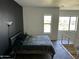 Stylish bedroom with black accent wall, sleek furniture, and inviting natural light at 1130 N 2Nd St # 401, Phoenix, AZ 85004