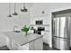 Modern kitchen featuring stainless steel appliances, white cabinets, modern countertops and island with sink at 1130 N 2Nd St # 401, Phoenix, AZ 85004