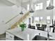 Bright open-concept kitchen and dining space featuring high ceilings, stainless steel railings, with a crisp, white color scheme at 1130 N 2Nd St # 401, Phoenix, AZ 85004