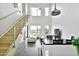 This bright living space features high ceilings, large windows, stainless steel railings, with a dining area and a crisp, white color scheme at 1130 N 2Nd St # 401, Phoenix, AZ 85004
