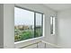 Bright stairway view showcases cityscape through large windows, complemented by neutral walls at 1130 N 2Nd St # 401, Phoenix, AZ 85004