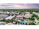 Expansive aerial view of a home with a private pool and beautifully landscaped backyard in a residential neighborhood at 1179 E Regent Dr, Gilbert, AZ 85298