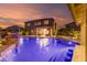 Spacious backyard with a refreshing pool, a covered patio, a fire pit, and mature landscaping at 1179 E Regent Dr, Gilbert, AZ 85298