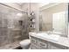 Updated bathroom with glass-enclosed shower, modern vanity, and stylish tile work at 1179 E Regent Dr, Gilbert, AZ 85298