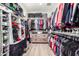 Organized walk-in closet offering ample storage with shelving, rods, and drawers for efficient organization of clothing at 1179 E Regent Dr, Gilbert, AZ 85298