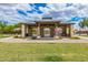 Community ramada with picnic tables and grills in a park-like setting at Layton Lakes at 1179 E Regent Dr, Gilbert, AZ 85298