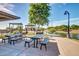 Layton Lakes picnic area with tables, benches, grills and lake views at 1179 E Regent Dr, Gilbert, AZ 85298