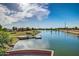 Community lake featuring multiple docks and lush landscaping, creating a relaxing outdoor space at 1179 E Regent Dr, Gilbert, AZ 85298