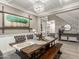Elegant dining room featuring a rustic wood table and decorative chandelier, perfect for Gathering gatherings at 1179 E Regent Dr, Gilbert, AZ 85298