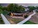 Community entrance sign with beautiful landscaping and decorative lighting welcomes residents and guests at 1179 E Regent Dr, Gilbert, AZ 85298
