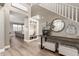 Inviting foyer with stylish accents, staircase, and an entrance leading into the expansive living room at 1179 E Regent Dr, Gilbert, AZ 85298