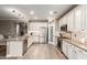 Spacious kitchen with white cabinetry, stainless steel appliances, granite countertops, and pantry at 1179 E Regent Dr, Gilbert, AZ 85298