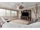 Comfortable living room with a large entertainment center, plush seating, and neutral decor at 1179 E Regent Dr, Gilbert, AZ 85298