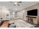 Open living area with plush sectional, decorative rug, and easy access to laundry area at 1179 E Regent Dr, Gilbert, AZ 85298