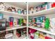 Walk-in pantry with ample shelving, offering plenty of storage for food and kitchen essentials at 1179 E Regent Dr, Gilbert, AZ 85298