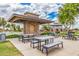 Community picnic area featuring covered seating and nearby playground, perfect for gatherings at 1179 E Regent Dr, Gilbert, AZ 85298