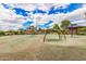 Community playground with colorful play equipment and grassy area, ideal for Gathering recreation at 1179 E Regent Dr, Gilbert, AZ 85298