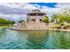 Picturesque water feature and gazebo create a serene community atmosphere by the lake at 1179 E Regent Dr, Gilbert, AZ 85298