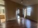 This bedroom features wood floors, two windows and a mirrored closet at 15329 W Melissa Ln, Surprise, AZ 85374