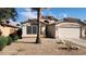 Charming single-story home with desert landscaping, a tile roof, and an attached two-car garage at 15329 W Melissa Ln, Surprise, AZ 85374