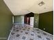 Open-concept living room features recessed lighting and decorative tile flooring at 15329 W Melissa Ln, Surprise, AZ 85374