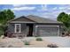 Beautiful single story home with a two car garage and modern grey color scheme at 15503 W Deanne Dr, Waddell, AZ 85355