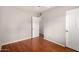 This bedroom has hardwood floors, neutral walls, and a ceiling fan at 1609 E Williams N St, Tempe, AZ 85281