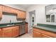 Functional kitchen with ample cabinet space, stainless steel appliances, and durable countertops at 1609 E Williams N St, Tempe, AZ 85281