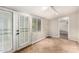 Bright living room featuring tiled floors, French doors, and neutral paint at 1609 E Williams N St, Tempe, AZ 85281