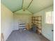 Interior of the shed showing shelving and concrete block walls at 1609 E Williams N St, Tempe, AZ 85281
