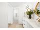 Bathroom featuring double sinks, sleek mirrors, updated fixtures, and an attached walk-in shower at 1631 E Gardenia Ave, Phoenix, AZ 85020